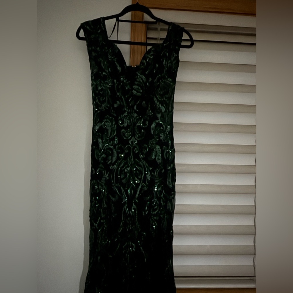 Black dark green background withh beautiful green sequence mermaid tight dresss